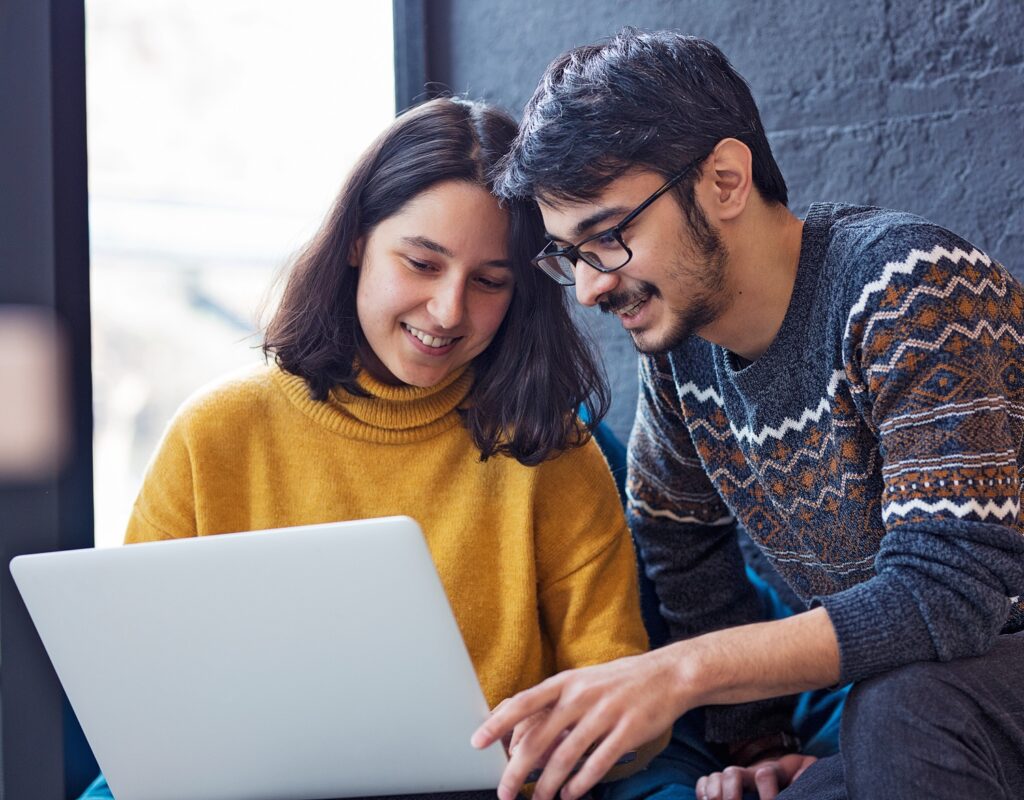 What Is More Important? Education Or Work Experience? 10 two colleagues working laptop 1